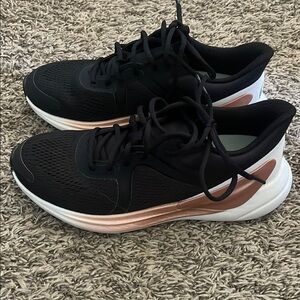 Lululemon Athletica Black and Pink Athletic Shoes with Streamlined Design